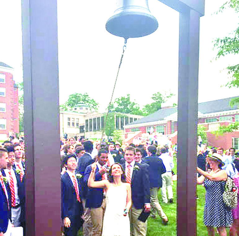 Olivia Stanley gets her turn to ring Suffield Academy’s traditional bell after Commencement.