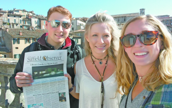 After the Pullen family enjoyed refreshing cups of Gelato, Zack Pullen holds the Observer for a photo before the skyline of Perugia, in central Italy, the “Universities City” where Kalina has been studying for the fall semester.  From the left: Zack, Kalina and Anne. 