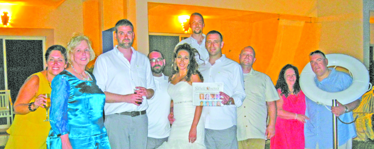 A Suffield couple took the Observer to Cancun, Mexico for a destination wedding in mid-May. Pictured at the reception are, from the left, in front: Julia Baldini, Pamela Baldini, Brandon Potemski, Gerry Baldini, Norma Navarro Baldini and Justin Baldini (the bride and groom), Damon Baldini, Joyce Preissner and Andy Preissner. Justin Richter is standing in the back.