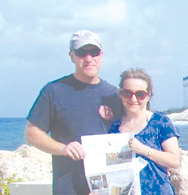 Rich and Cheryl Leach took time out from their 25th anniversary celebration cruise in June and read the Observer in Willemstad, Curaçao.