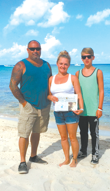 Sylvia Guyette made sure she took the Observer along when she visited the Iberostar resort in Cozumel, Mexico, with Eric Daniels and her son Avery in July.