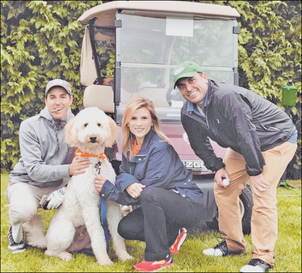 Kelly Kannen, center, is pictured at the Suffield Country Club during the October 1 golf outing supporting her entry to run in the New York Marathon for the ASPCA on November 6. With her are friends Bryce Johnstone, left, and Dan Presser plus ASPCA mascot Cooper Manning.