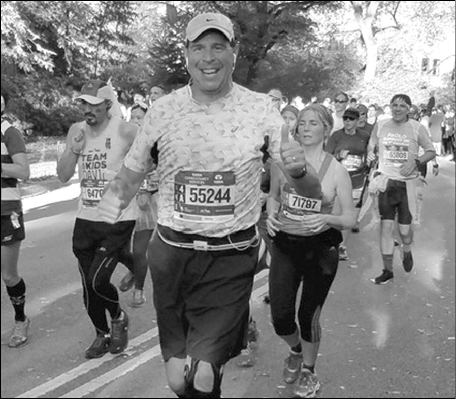 Suffield’s Gerry La Plante is pictured with a smile near the finish line of the New York Marathon on November 6. His time? 5:00:00!
