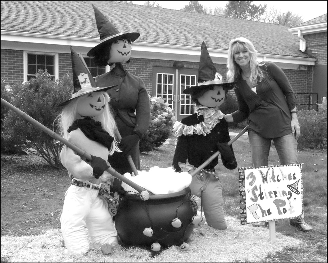 Kris Lambert poses with the scarecrow trio the First Selectman’s office prepared for Scare-It-Up Suffield on October 21. The office comprises First Selectman Melissa Mack and her two part-time administrative assistants, Kris Lambert and Kim Worthington; the sign reads, “3 Witches Stirring the Pot.” It’s not surprising that the assemblage was judged “Most Creative.”