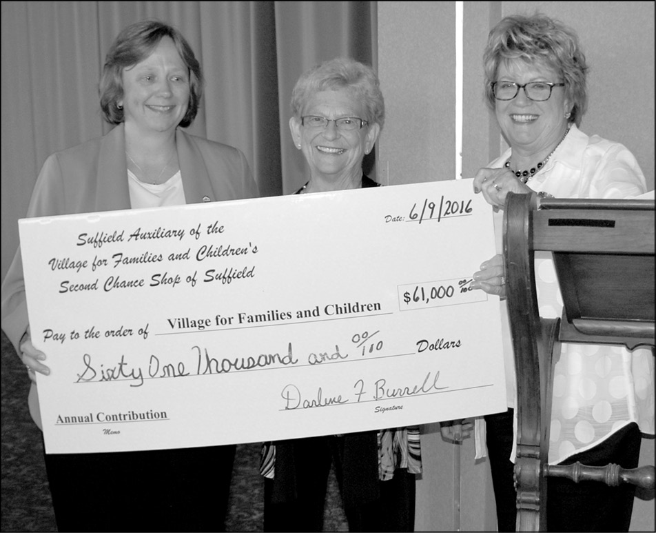 Liz Bryden of The Village for Families and Children, left, accepts a $61,000 check from Suffield Auxiliary co-presidents, Sharen Lingenfelter, center, and Lee Galluccio.