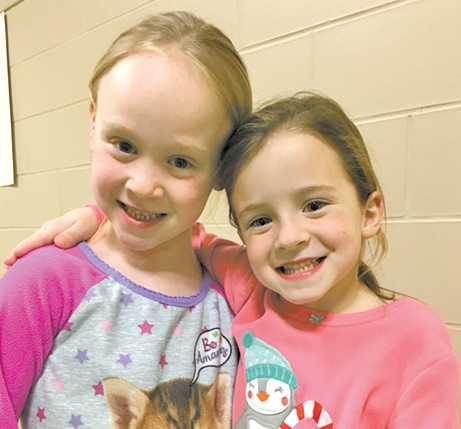Spaulding School students Juniper Proulx, left, and Lilyana Van Cott are excited in their comfy clothes for the Grade 1 PJ and Movie Night sponsored by the PTO.