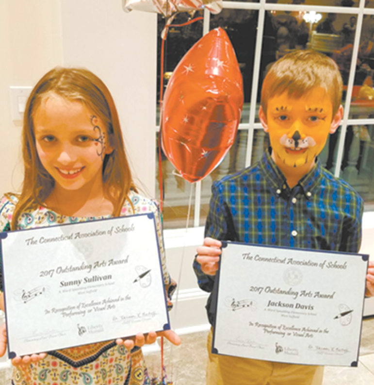 Second grade Spaulding School students Sunny Sullivan and Jackson Davis proudly display their certificates at the Connecticut Association of Schools Art Festival.