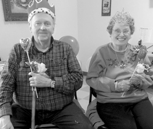King Michael Olzcewski and Queen Nancy Berry reign happily from their improvised thrones. They were crowned at the Friends of Suffield Senior Valentine Social held February 11 at the Suffield Senior Center.
