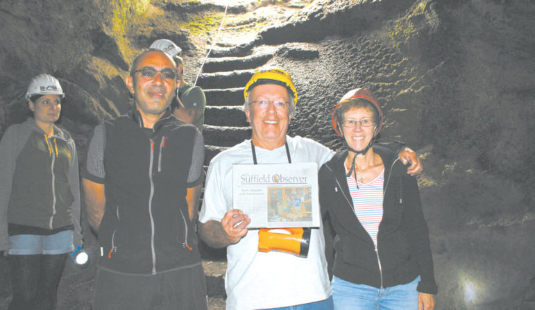 Lou and Celeste Planzo are photographed with the Observer in one of the caves created by volcanic eruptions of Mt. Etna on the Italian island of Sicily. At the left is their guide Gian Paolo. The Planzos toured the island in September during their two-week trip through southern Italy and Sicily.
