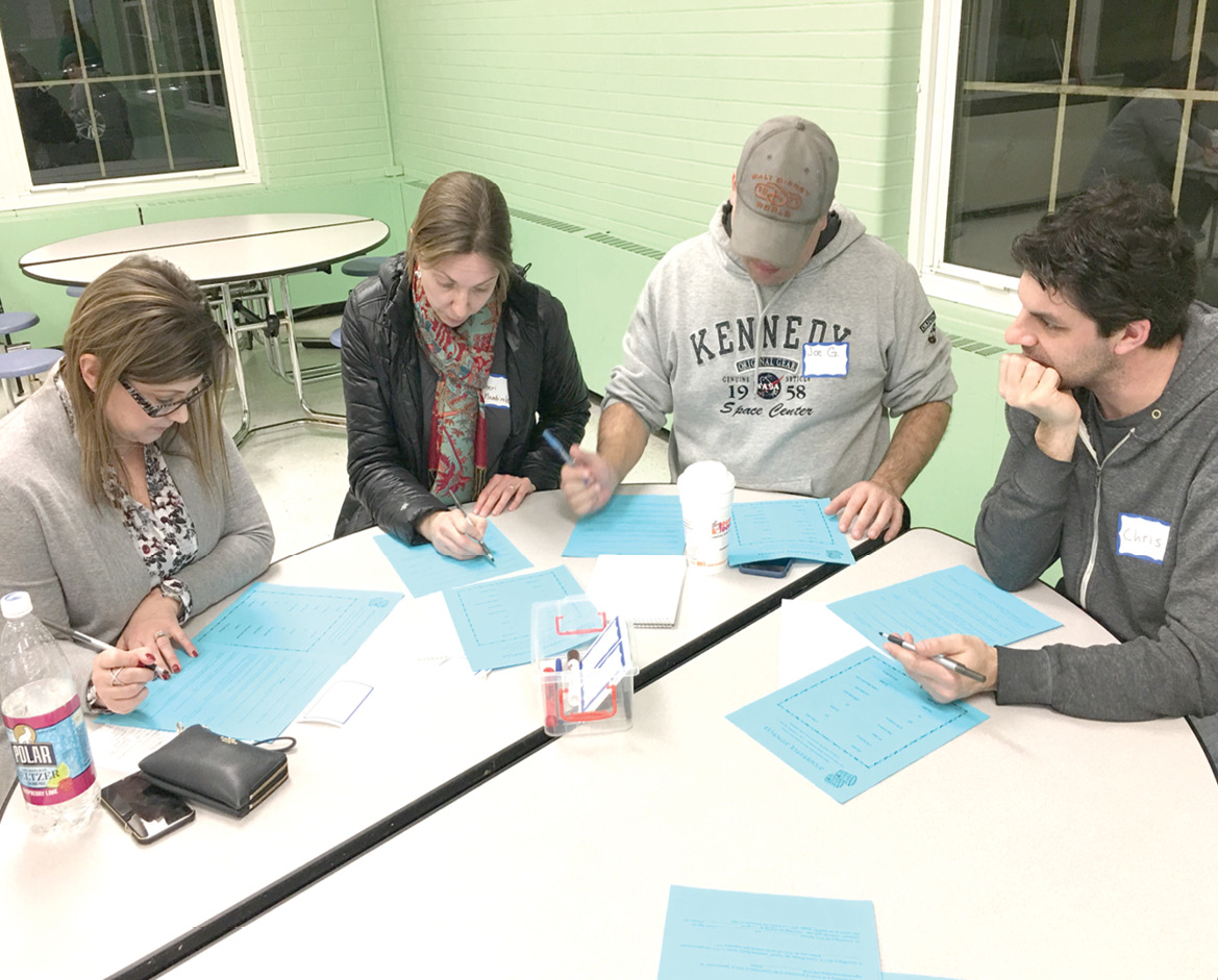Spaulding School parents engage in an activity that promotes discussion and understanding of number sense at a recent Parent Math Night.
