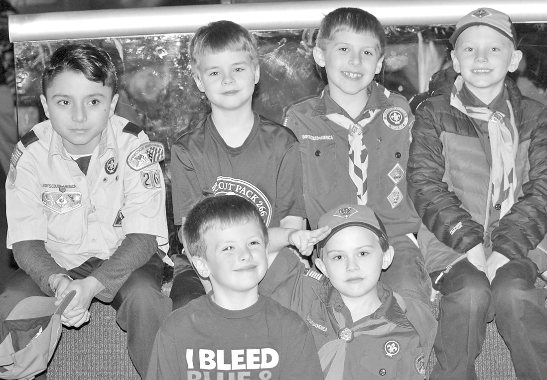 Members of Cub Pack 266 pose for a picture during a recent overnight stay at the Boston Museum of Science.