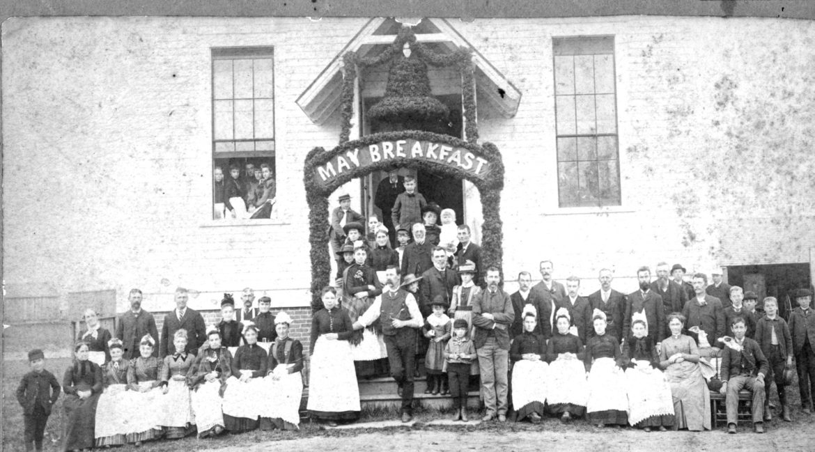Suffield's May Breakfast at Mapleton Hall was a popular spring event, attracting many hundreds of hungry diners throughout the big day in the last decades of the 19th century and well into the 20th, especially after the trolley came through Mapleton Avenue in 1902. This portrait of the Mapleton Hall Association volunteers who made it happen was taken prior to the 10 a. m. start, in about 1900. 
