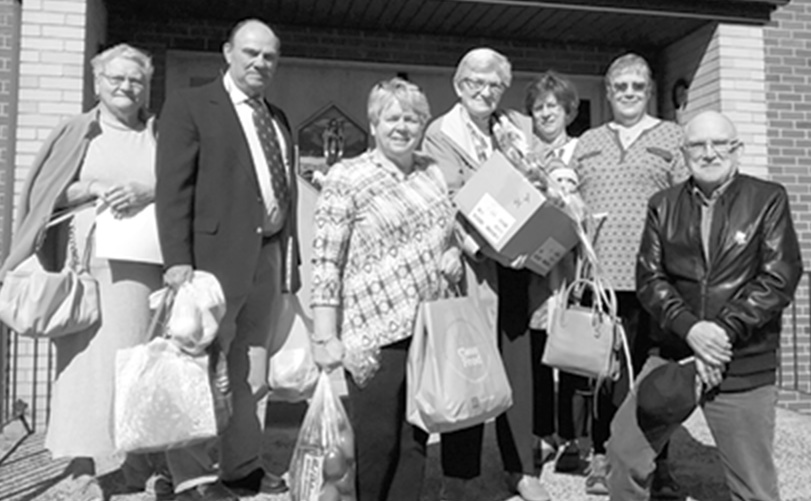 Members of Good Shepherd Lutheran Church are pictured on the church’s front steps on South Street.  They collected and donated an outstanding amount of fresh fruits and vegetables to be distributed to the 53 Suffield households receiving Easter/Spring baskets at the EAA. Girl Scout Troop 10973 assembled all the baskets.