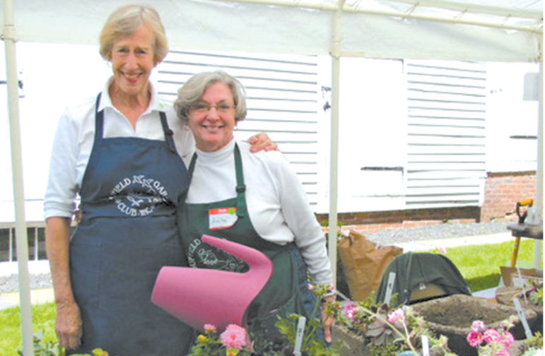 Peggy Robards and Anita Wardell, left and right, are pictured at the Suffield Garden Club’s booth during a previous May Market.