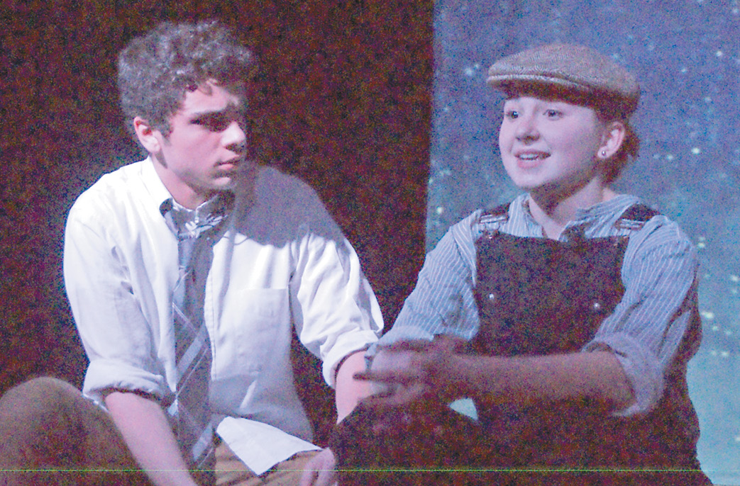 In the Suffield Youth Theater’s production of Burdens, Maisie, (Kayla Lazzari) reminisces about her life before she ran away and dreams of something better.  Former boy-friend Tom (Dominic Colangelo), also now a wanderer, advises her to return home.