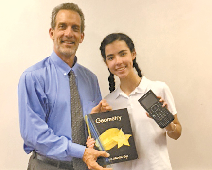 Suffield native Larry Tavino, Teacher iof the Year in Hilton Head Prep, was pictured in a school promotional shot with Ella Tomita, one of the eighth grade students.