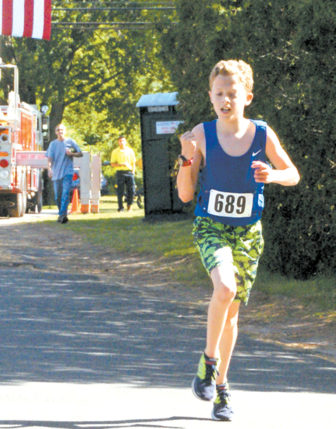 The year’s first finisher in the Fireman’s 5K Race on June 4 was Charles Brydges, 15, shown about two yards from the finish line.
