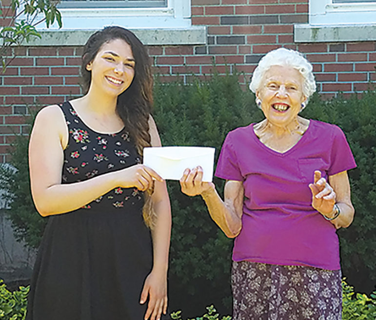 Gianna Mangiarelli, left, receives the certificate for a scholarship from Mary Mellor, chairman for the Suffield Woman’s Club’s $5,000 Thea Coburn Scholarship.  Gianna is pursuing a major in communications with a concentration in journalism.