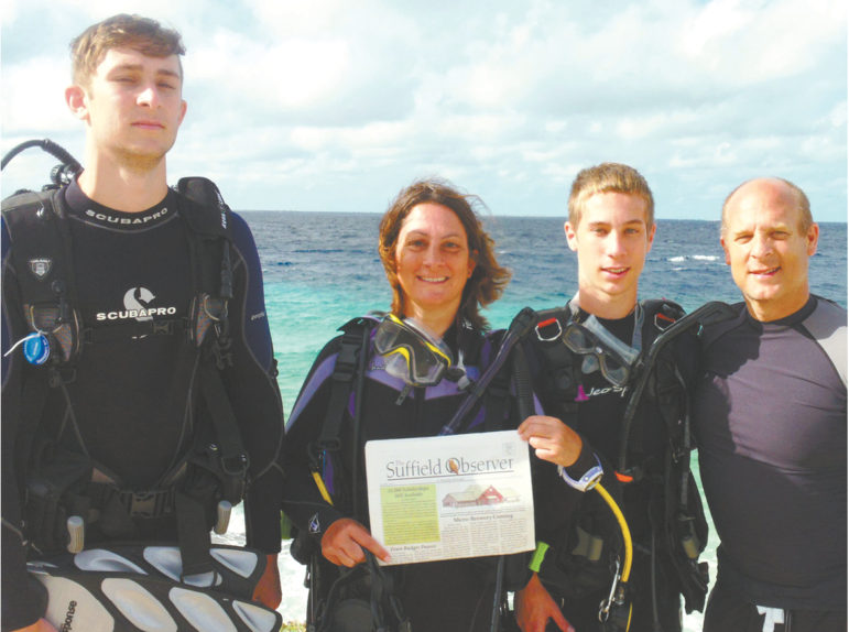 Ryan, Julie, Dylan and Paul Carzello capture a moment with the Observer before a morning SCUBA dive at Ol’ Blue, a long coral beach in Bonaire, an island in the leeward Antilles of the Caribbean. The sea creatures and colorful corals in moderate depths at the Ol’ Blue are famous.