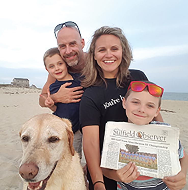 The Moore family took the Observer along in July to read on the ferry and the Nantucket beach. Clockwise from Mya, who must have enjoyed catching frisbees on the sand, are Griffin, Brendan, Kendall and Sullivan.