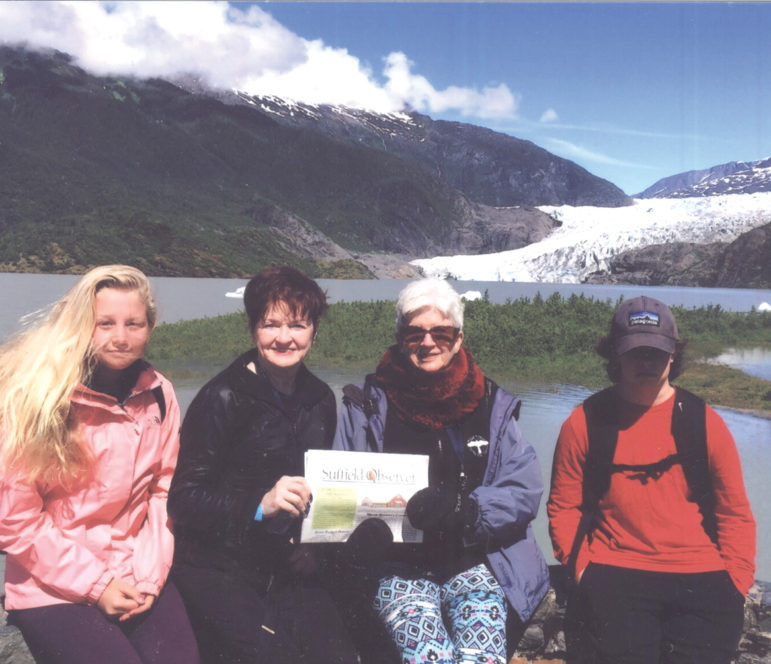 On a recent trip to Alaska, four Suffield travelers stopped in Juneau at the Mendenhall Glacier for a photo with the Observer. From the left: Bella Nutini, Kathy Krar, Dian Friedman and Zachary Krar.