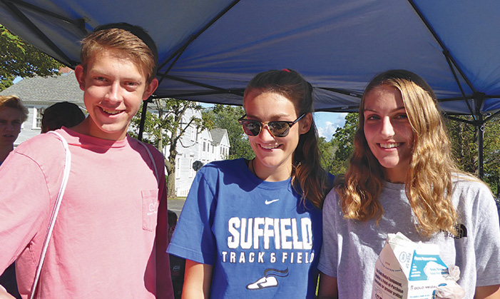 Michael Sattan, Mary Rusnock and Vera Raskina enjoy spinning cotton candy to benefit SHS Class of 2019.