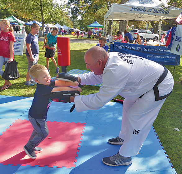 Doug Caputo from Family Martial Arts was no competition for three-year-old William Johnston. William was able to kick off the instructor’s glove.