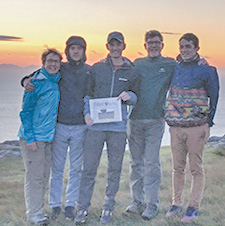On the westernmost point of the Isle of Skye, Scotland, this summer, the Dodds family poses with the Observer at Sunset.