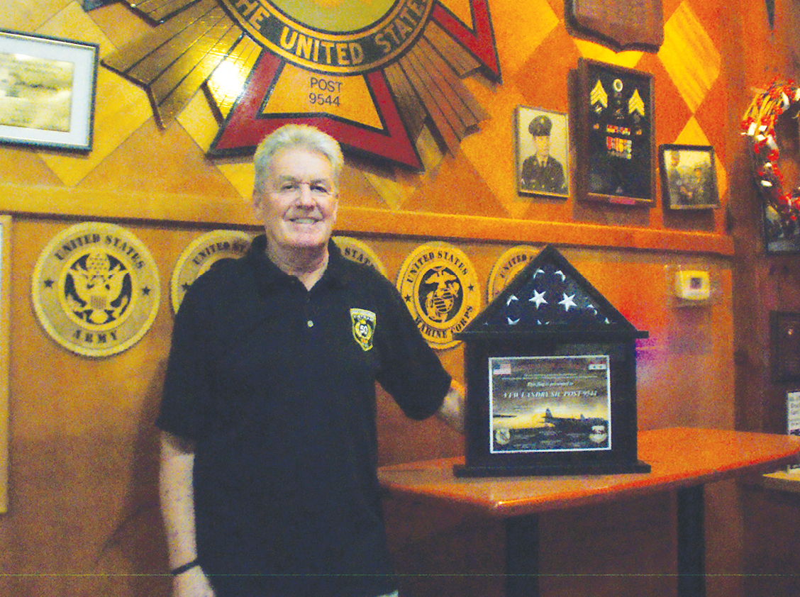 Viet Nam veteran Jim Hunter, former commander of Suffield’s VFW Post 9544, is pictured at the lodge with a folded, framed U. S. flag donated by Jeremiah Pendleton, a C-130 loadmaster and Brian Sheldon, a flight engineer, both recently returned from the Middle East war. The flag had been carried in C-130’s during many combat missions over Iraq and Syria.