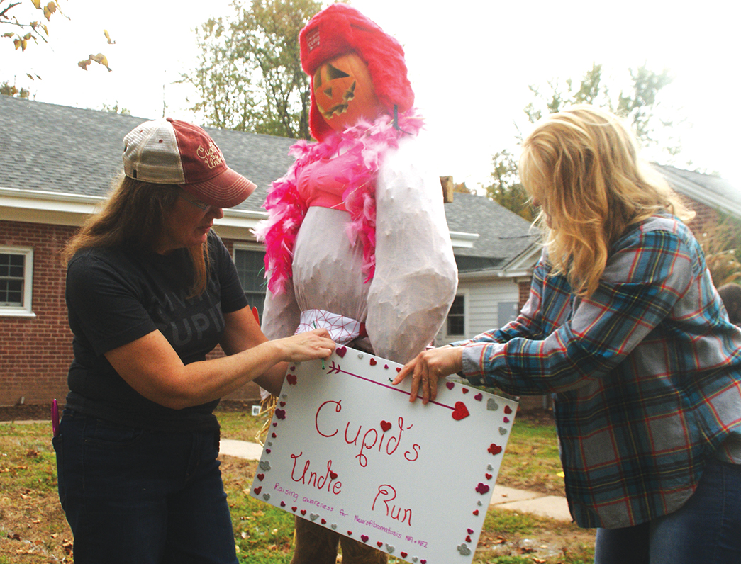 Winning this photographer’s award for most provocative scarecrow in the Scare-It-Up-Suffield event on September 14 was Cupid’s Undie Run, named for the Boston fundraiser event of that name, when participants in their underwear run in February to raise money for fighting neurofibromytosis. Amy Reay and Becky Varholek are shown installing their scarecrow, garbed for that run. Their team was a top fundraiser in this year’s event.