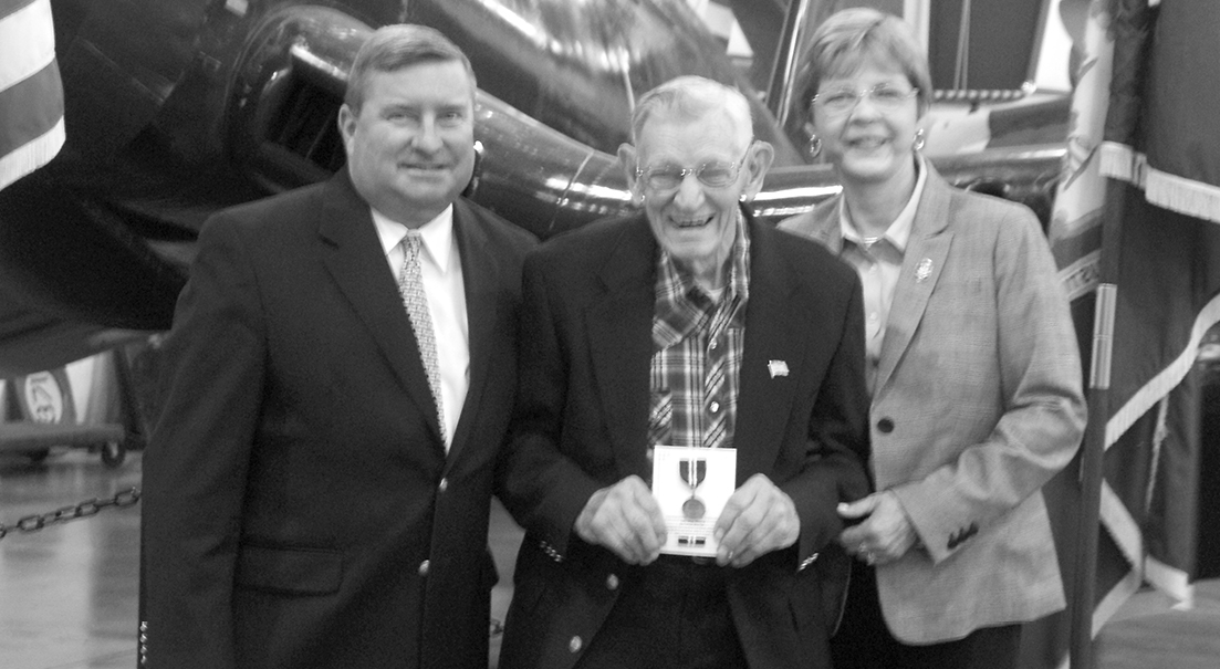 Along with State officials who made the presentation, Bob Sheldon poses with his new Connecticut Veterans Wartime Service Medal. From the left: Senator John Kissel, Sheldon, and Representative Tami Zawistowski.  The award ceremony on September 19 was held at the New England Air Museum. 