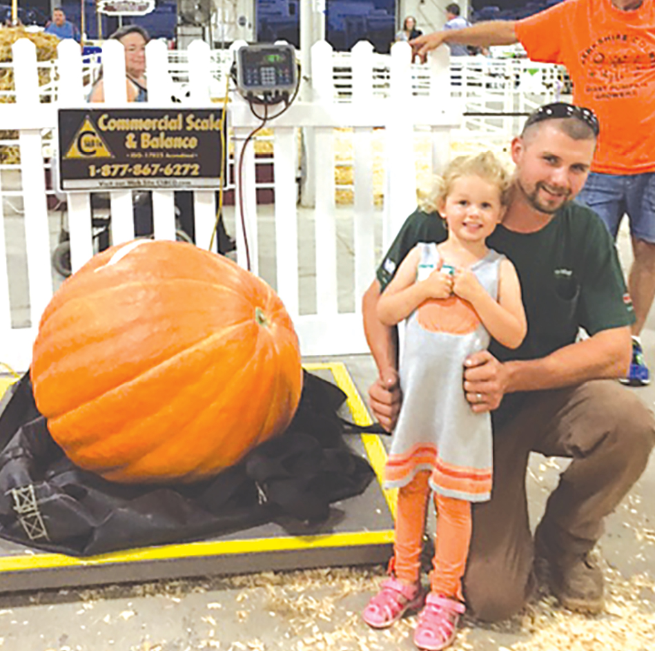 Anna Bielonko with her dad, Ben, wins Bronze Medal for her 187-pound giant pumpkin.