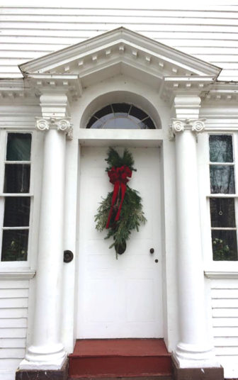 The Phelps wing’s front door is decorated elegantly for the holidays.