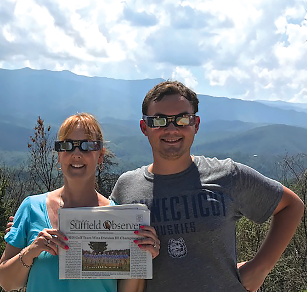 Leslie Marx and her son Khiel Marx took the Observer to the Smoky Mountains to read in Gaitlinburg, Tennessee, while they waited to view the total eclipse through their Kent Memorial Library glasses.