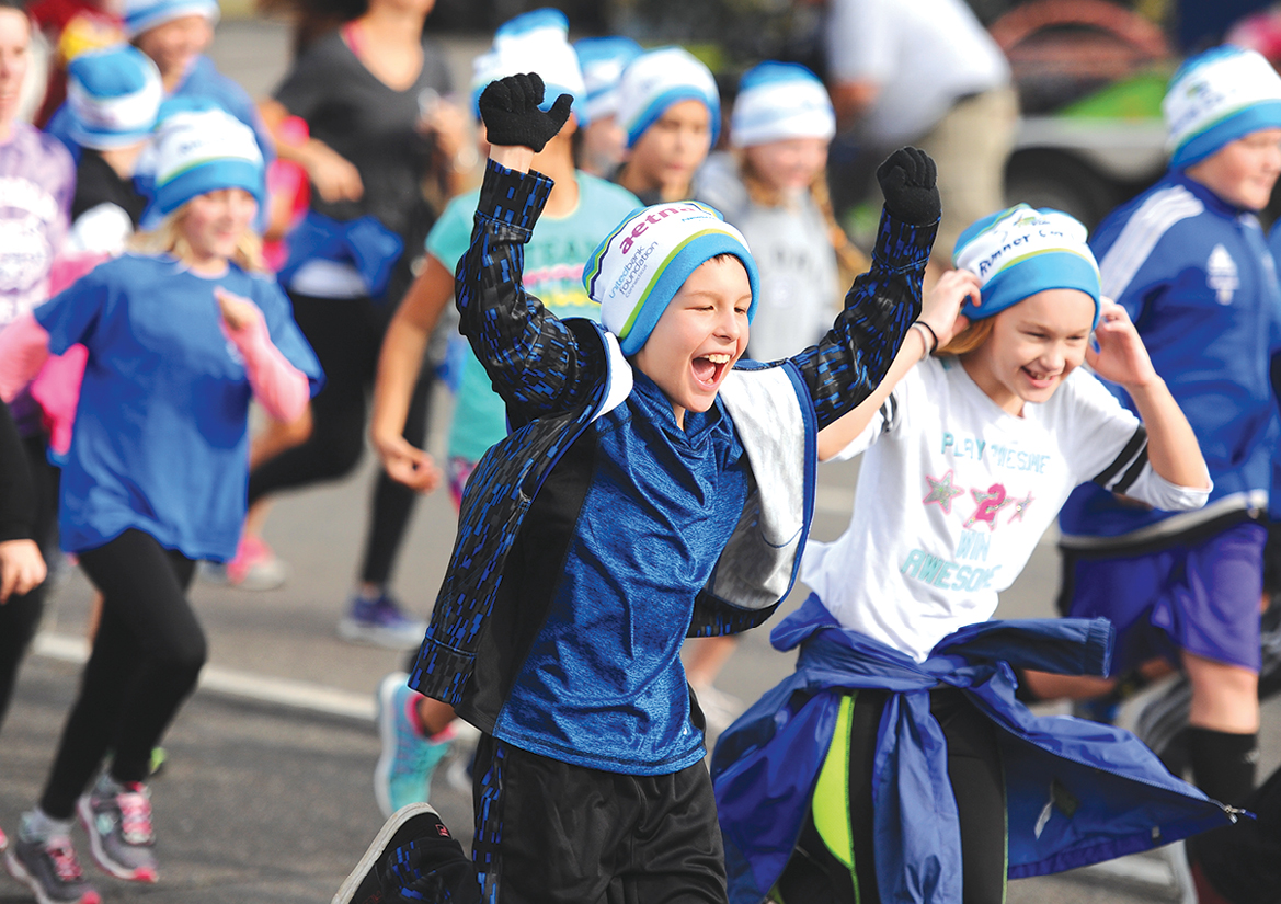 Unidentified youngsters start out on their final mile run in the HMF FitKids program. (HMF is the Hartford Marathon Foundation.)