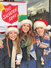 From the left: Laura, Alyssa and Brenna Frechette ring the bell for the Salvation Army at a recent blood drive.