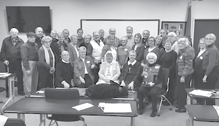 Members of Suffield’s Polish Heritage Society assemble for a group portrait after some joyful Polish carol singing at the group’s December meeting.