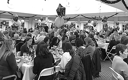 A big crowd of generous supporters enjoy a great buffet dinner, Bingo, and a very successful fund-raising auction in the dining room at Suffield by the River.