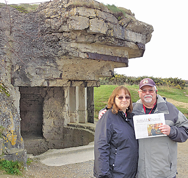 Sandy and Mike Cahill are pictured with the Observer during a November trip to France. Behind them is a World War II German gun emplacement at Pointe du Hoc in Normandy, a key strong point between Utah and Omaha beaches of the Allied landings on June 6, 1944.