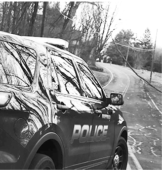 Suffield Police cruiser guards downed wire.