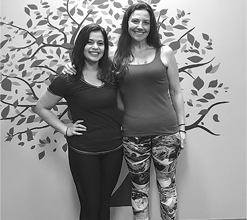 Pilates instructor Zoila Polis, left,  and proprietor Ivana Walker are pictured in front of the beautiful logo that symbolizes the spirit of Zen Valley Yoga, a new business at Ebb’s Corner in West Suffield.